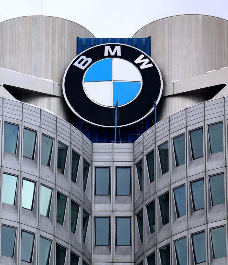 epa11011870 A general view of the company logo on the facade of the iconic headquarters building of German automobile maker BMW in Munich, Germany, 05 December 2023, on the same day the plant was visited by German Chancellor Scholz. EPA/ANNA SZILAGYI