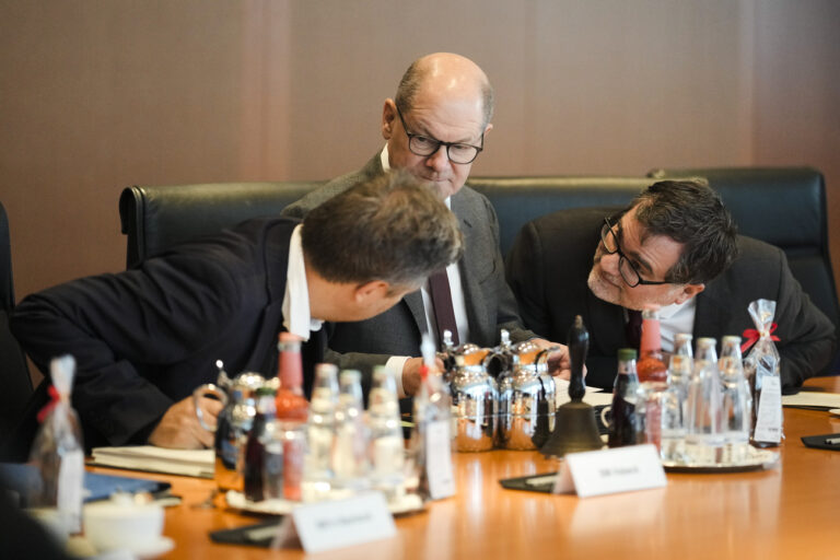 German Chancellor Olaf Scholz, center, listens to a conversation between German Economy and Climate Minister Robert Habeck, left, and Chief of Staff at te Chancellery Wolfgang Schmidt, right, during the cabinet meeting of the German government at the chancellery in Berlin, Germany, Wednesday, Dec. 6, 2023. (AP Photo/Markus Schreiber)