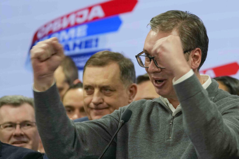Serbian President Aleksandar Vucic celebrates in his party headquarters after a parliamentary and local election in Belgrade, Serbia, Sunday, Dec. 17, 2023. Serbia's governing populists claimed a sweeping victory Sunday in the country's parliamentary election, which was marred by reports of major irregularities both during a tense campaign and on voting day. (AP Photo/Darko Vojinovic)