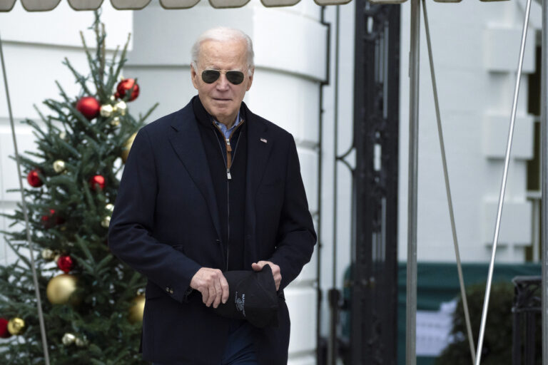 President Joe Biden walks towards the members of the media as he leaves the White House to spend the Christmas holiday with his family at Camp David presidential retreat, near Thurmont, Md., Saturday, Dec. 23, 2023. (AP Photo/Manuel Balce Ceneta)