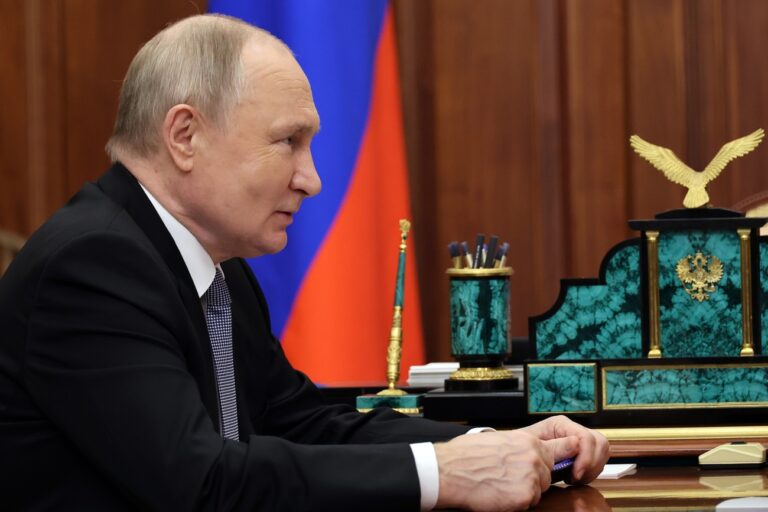 Russian President Vladimir Putin listens to Aeroflot Russian air company chairman and CEO Sergei Aleksandrovsky during their meeting at the Kremlin, in Moscow, Russia, Friday, Dec. 29, 2023. (Gavriil Grigorov, Sputnik, Kremlin Pool Photo via AP)