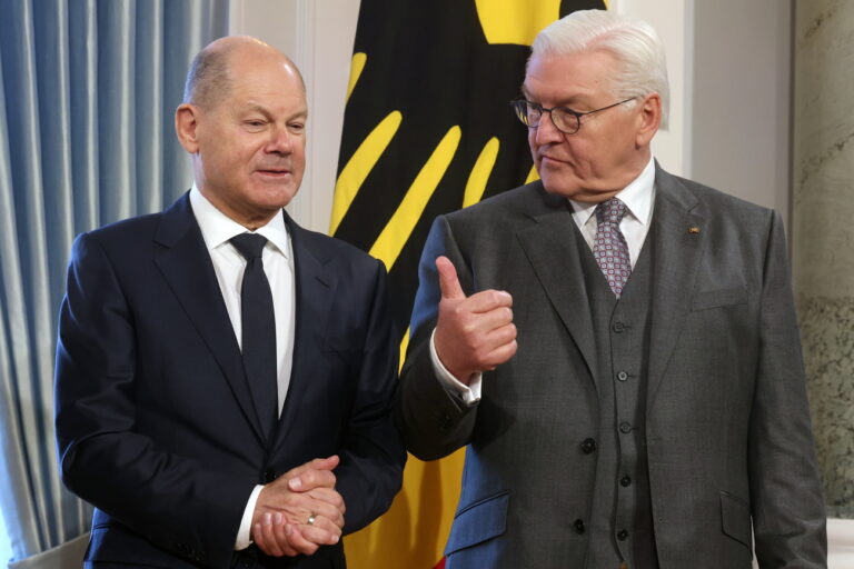 epa11065656 German President Frank-Walter Steinmeier (R) gestures next to German Chancellor Olaf Scholz during the New Year's reception at the Bellevue Palace in Berlin, Germany, 09 January 2024. The German president and his wife invited representatives of public life, citizens from all federal states who have made a special contribution to the common good, to thank the guests for their commitment. EPA/CLEMENS BILAN