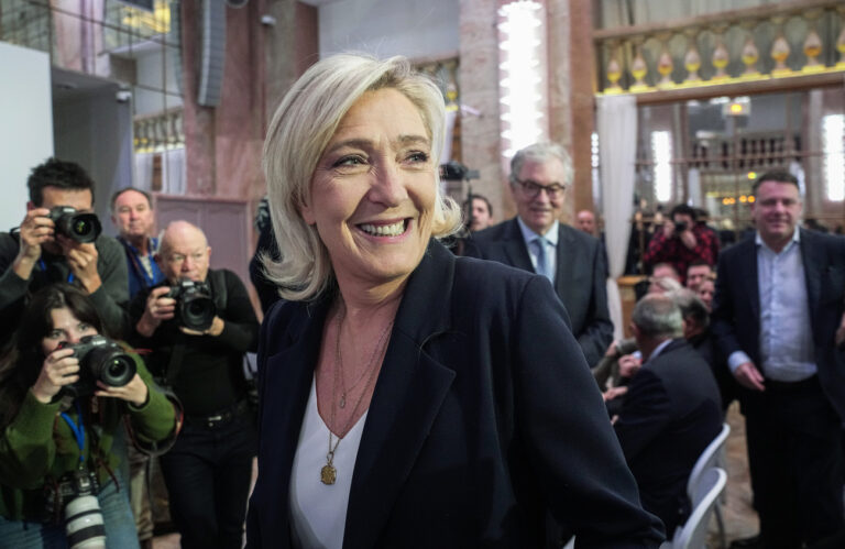 French far-right National Rally party leader Marine Le Pen arrives for the New Year's speech to the media in Paris, Monday, Jan. 15, 2024. (AP Photo/Michel Euler)