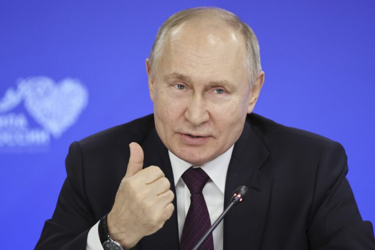 Russian President Vladimir Putin gestures with speaking at a meeting with heads of municipalities in the constituent entities of Russia during the Russian Municipal Forum 