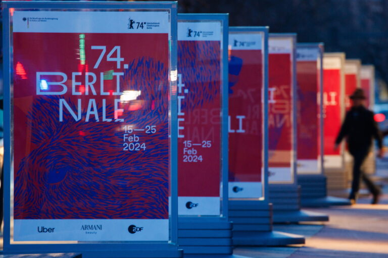 epa11113033 A passers-by walks near Berlinale posters at Potsdamer Platz square in Berlin, Germany, 29 January 2024. The 2024 edition of the upcoming Berlin International Film Festival 'Berlinale' will run from 15 to 25 February. EPA/CLEMENS BILAN