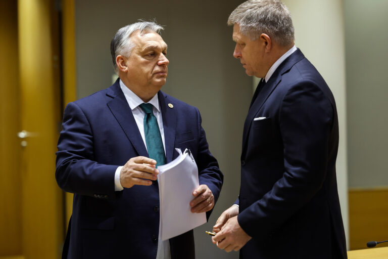 Slovakia's Prime Minister Robert Fico, right, talks to Hungary's Prime Minister Viktor Orban during a round table meeting at an EU summit in Brussels, Thursday, Feb. 1, 2024. European Union leaders meet in Brussels for a one day summit to discuss the revision of the Multiannual Financial Framework 2021-2027, including support for Ukraine. (AP Photo/Geert Vanden Wijngaert)