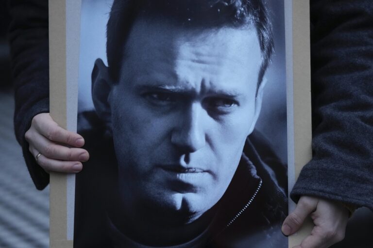 A protester stages a demonstration opposite the Russian Embassy in London, Friday, Feb. 16, 2024, in reaction to the news that jailed Russian opposition leader Alexei Navalny has died in a Russian prison, according to the Federal Penitentiary Service. (AP Photo/Kin Cheung)