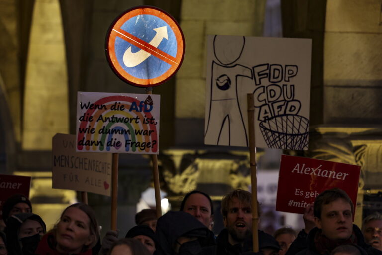 epa11158904 Protesters at Muenster town hall during a demonstration against the AfD (Alternative for Germany) New Year's reception in Muenster, Germany, 16 February 2024. The alliance 