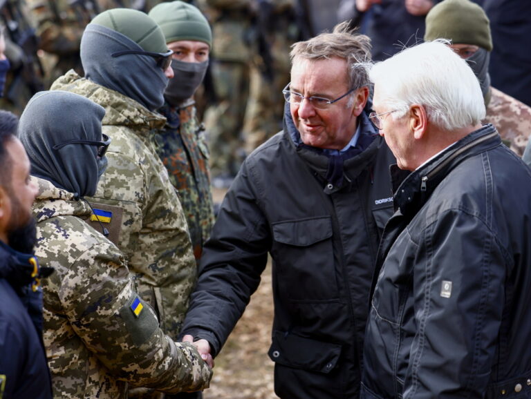 epa11175006 German President Frank-Walter Steinmeier (R) and German Defense Minister Boris Pistorius speak to Ukrainian soldiers during a demonstration by the German armed forces Bundeswehr, in Klietz, Germany, 23 February 2024. The Special Training Command of the EU training mission EUMAM and the Bundeswehr's mobile logistics troops are training Ukrainian soldiers at the site. EPA/HANNIBAL HANSCHKE
