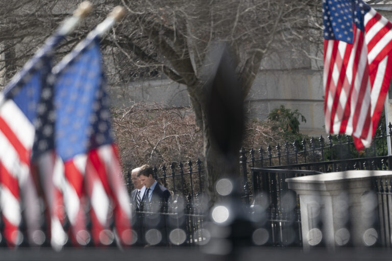 President Joe Biden, left, leaves the Eisenhower Executive Office Building on the White House complex in Washington after participating in a video conference call with G7 leaders and Ukraine's President Volodymyr Zelenskyy to discuss support for Ukraine, Saturday, Feb. 24, 2024. (AP Photo/Stephanie Scarbrough)