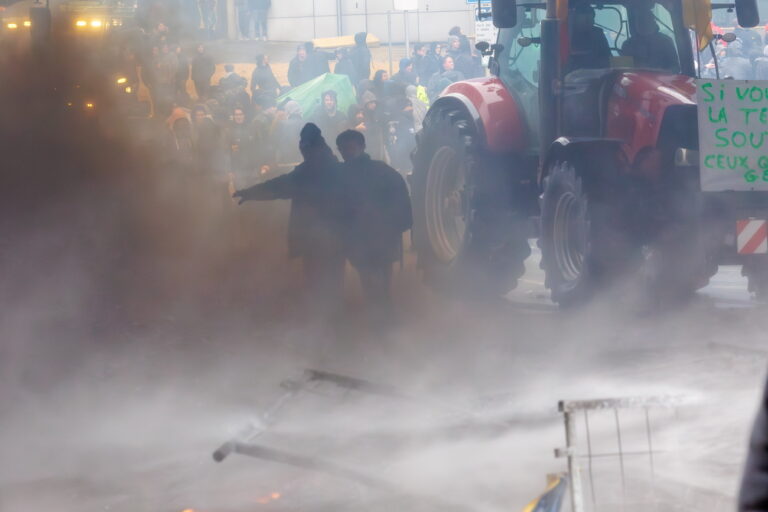 epa11182925 Police forces use water cannon to disperse burning barricades during a protest of European farmers around the Justus Lipsius Council building on the sidelines of a meeting of an EU Agriculture and Fisheries Council meeting in Brussels, Belgium, 26 February 2024. Farmers are protesting to highlight their declining incomes, overly complex legislation and administrative overload. The discontent among farmers, initially sparked in France, has spilled over into several European countries, including Belgium. EPA/OLIVIER MATTHYS