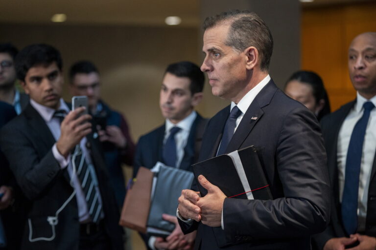 epa11187618 Hunter Biden, son of US President Joe Biden, looks on as his lawyer delivers remarks to the news media following a closed door interview as part of the Republican-led House of Representatives impeachment inquiry at the O'Neill House Office Building in Washington, DC, USA, 28 February 2024. The closed-door deposition occurs after a key witness in Republicans' impeachment inquiry was charged with lying about the business dealings of the first family. EPA/SHAWN THEW