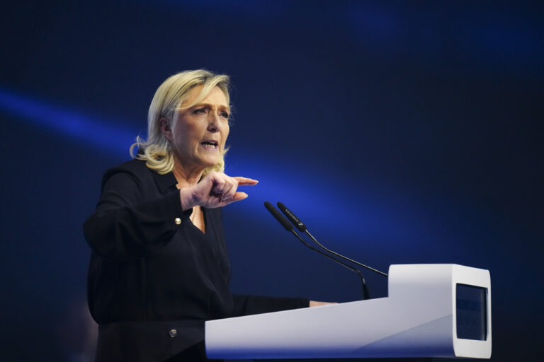 French far-right National Rally party leader Marine Le Pen delivers a speech at a meeting in Marseille, southern France, Sunday, March 3, 2024. (AP Photo/Daniel Cole)