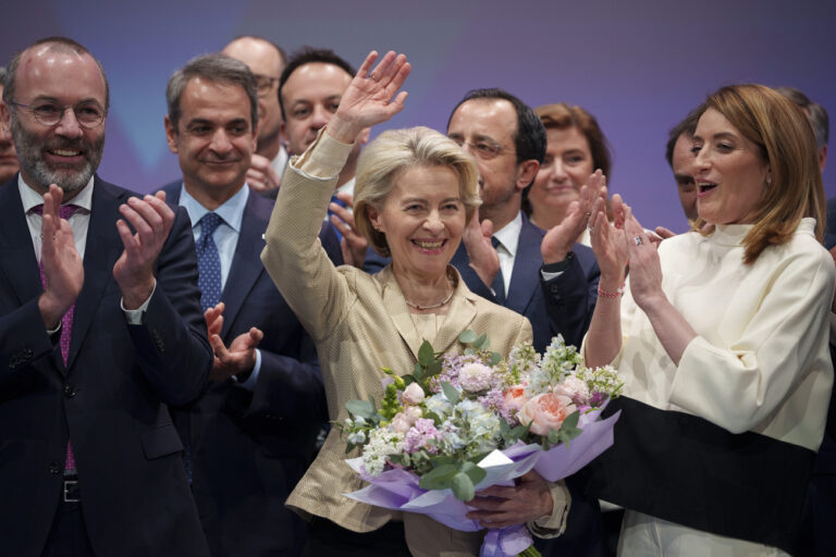 European Commission President Ursula von der Leyen waves, as European Parliament President Roberta Metsola, right, and Manfred Weber, head of the Group of the European People's Party, left, applaud at the end of the EPP Congress in Bucharest, Romania, Thursday, March 7, 2024. The 2024 EPP Congress designated Germany's Ursula von der Leyen, who seeks a second term as head of the European Union's powerful Commission, as the party's lead candidate in the upcoming European elections. (AP Photo/Andreea Alexandru)