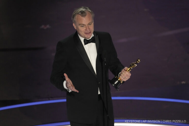 Christopher Nolan accepts the award for best director for 
