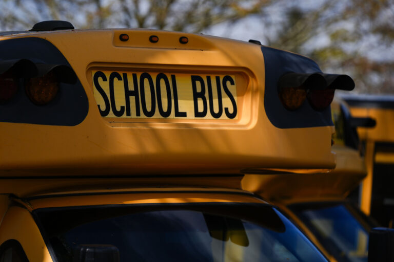 A Portland Public Schools bus is seen on Friday, April 5, 2024, in Portland, Ore. A young girl and her guardian have sued an Oregon nonprofit organization, Portland Public Schools and Multnomah County for $9 million, alleging they were negligent when male classmates sexually abused her at school and raped her during an after-school program when she was a nine-year-old third grader. (AP Photo/Jenny Kane)