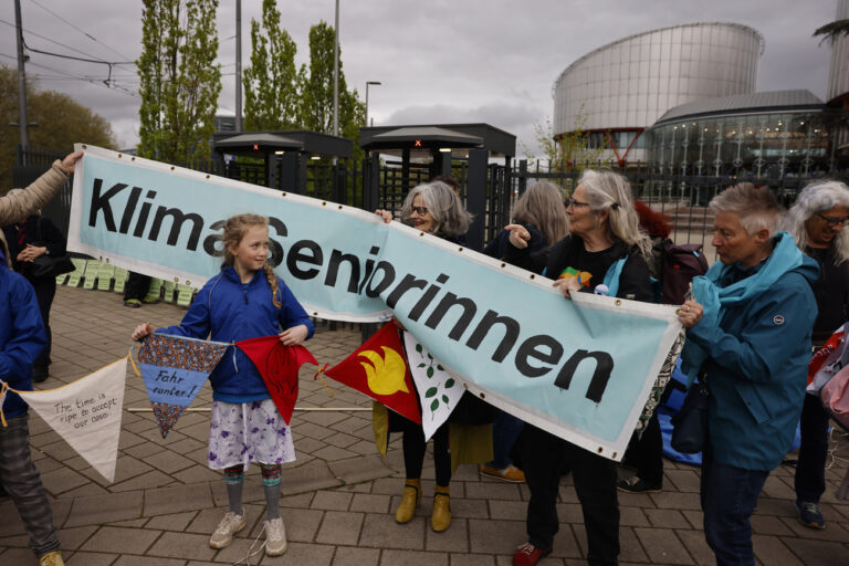 Swiss women demonstrate outside the European Court of Human Rights Tuesday, April 9, 2024 in Strasbourg, eastern France. Europe's highest human rights court will rule Tuesday on a group of landmark climate change cases aimed at forcing countries to meet international obligations to reduce greenhouse gas emissions. The European Court of Human Rights will hand down decisions in a trio of cases brought by a French mayor, six Portuguese youngsters and more than 2,000 elderly Swiss women who say their governments are not doing enough to combat climate change. (AP Photo/Jean-Francois Badias)