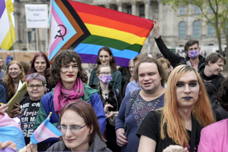 Demonstrators protest demanding a law to protect the rights of the transgender community outside of the parliament Bundestag building in Berlin, Friday, April 12, 2024. German lawmakers on Friday approved legislation that will make it easier for transgender, intersex and nonbinary people to change their name and gender in official records. (AP Photo/Ebrahim Noroozi)