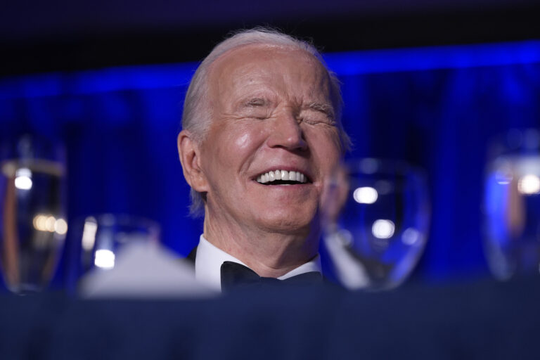 President Joe Biden laughs as host Colin Jost speaks at the White House Correspondents' Association Dinner at the Washington Hilton, Saturday, April 27, 2024, in Washington. (AP Photo/Manuel Balce Ceneta)