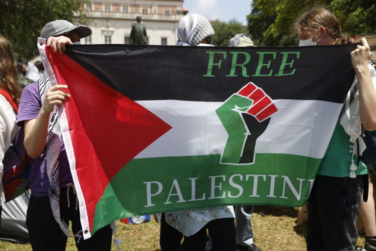 epa11309347 Students hold up a Palestinian flag during a Protect Palestine Rally on the University of Texas at Austin campus in Austin, Texas, USA, 29 April 2024. Campus police officers from the University of Texas at Austin and state troopers in riot gear arrested dozens of pro-Palestinian protesters who had erected a small number of tents on a central mall of the university. More than 34,000 Palestinians and over 1,450 Israelis have been killed, according to the Palestinian Health Ministry and the Israel Defense Forces (IDF), since Hamas militants launched an attack against Israel from the Gaza Strip on 07 October 2023, and the Israeli operations in Gaza and the West Bank which followed it. EPA/ADAM DAVIS