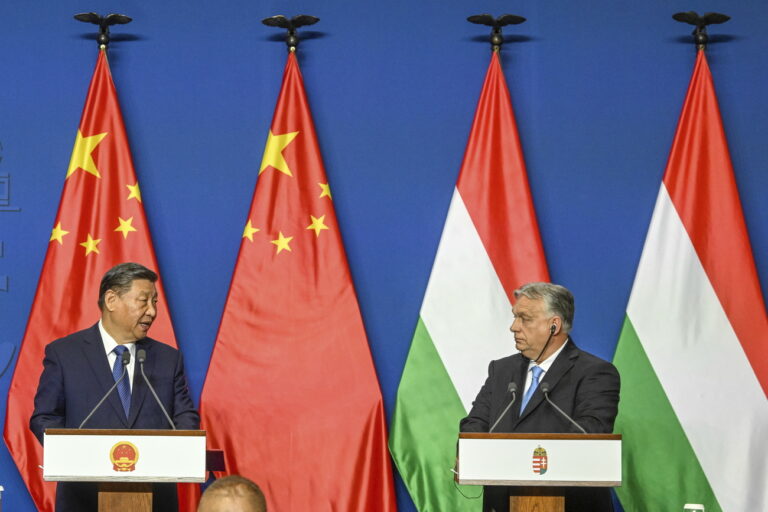 Chinese President Xi Jinping, left, speaks during his joint press conference with Hungarian Prime Minister Viktor Orban following their talks at the PM's office, the former Carmelite Monastery, in Budapest, Hungary, Thursday, May 9 2024. (Szilard Koszticsak/MTI via AP)