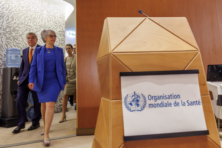 International Olympic Committee (IOC) President Thomas Bach, left, and Swiss Interior Minister Elisabeth Baume-Schneider, 2nd left, arrive for the opening of the 77th World Health Assembly (WHA77) at the European headquarters of the United Nations in Geneva, Switzerland, Monday, May 27, 2024. (KEYSTONE/Salvatore Di Nolfi)