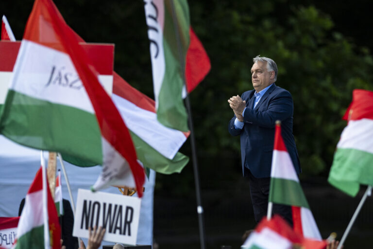 Hungary's Prime Minister Viktor Orbán addresses people as they gather to support him and his party during a 