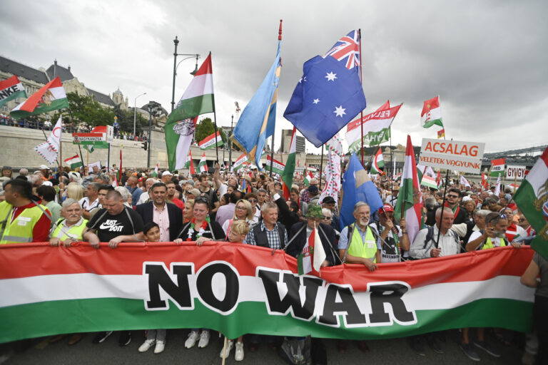 Participants gather on the Pest embankment of the Danube river during a march, in Budapest, Hungary, Saturday, June 1, 2024. A crowd of tens of thousands gathered in Hungary's capital on Saturday in a show of strength behind Prime Minister Viktor Orbán a week ahead of European Parliament elections, a contest that he has cast as an existential turning point between peace and a world war. (Zsolt Czegledi/MTI via AP)