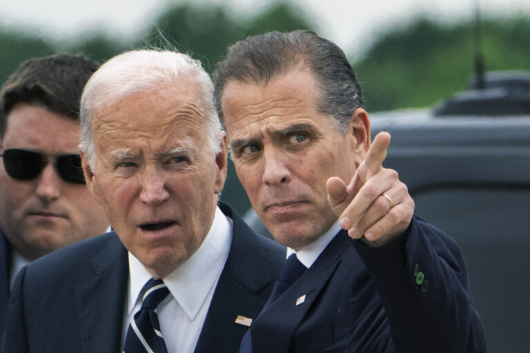 President Joe Biden talks with his son Hunter Biden as he arrives Delaware Air National Guard Base in New Castle, Del., Tuesday, June 11, 2024. (AP Photo/Manuel Balce Ceneta)