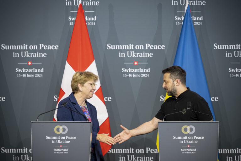 Swiss Federal President Viola Amherd (left) shakes hands with President Volodymyr Zelenskyy of Ukraine (right) during the closing press conference of the Summit on peace in Ukraine, in Stansstad near Lucerne, Switzerland, Sunday, June 16, 2024. Heads of state from around the world gather on the Buergenstock Resort in central Switzerland for the Summit on Peace in Ukraine, on June 15 and 16. (KEYSTONE/EDA/POOL/Urs Flueeler)