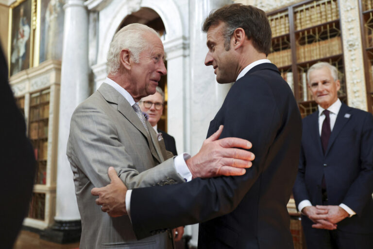 Britain's King Charles, left, greets French President Emmanuel Macron during the European Political Community meeting, near Oxford, England, Thursday July 18, 2024. (Hollie Adams/Pool via AP)