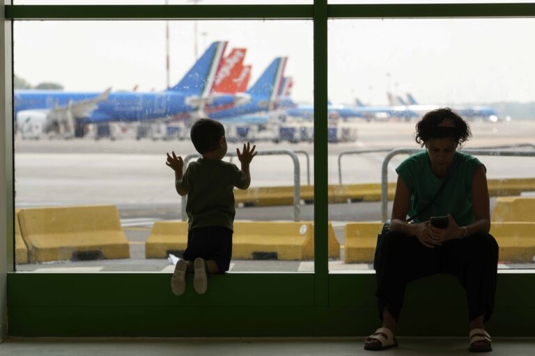 Travellers wait at a gate of the Linate airport in Milan, Italy, Friday, July 19, 2024 as many flights have been delayed or cancelled due to the worldwide internet outage. Microsoft says users worldwide may be unable to access various Microsoft 365 apps and services in a widespread outage. The cause, exact nature and scale of the outage was unclear. Microsoft appeared to suggest in its X posts that the situation was improving, but hours later, widespread outages were being reported by airlines around the world.A widespread Microsoft outage disrupted flights, banks, media outlets and companies around the world on Friday. (AP Photo/Luca Bruno)