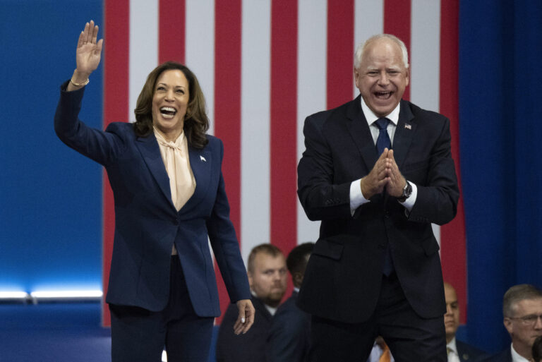 Democratic presidential nominee Vice President Kamala Harris and her running mate Minnesota Gov. Tim Walz arrive at a campaign rally in Philadelphia, Tuesday, Aug. 6, 2024. (AP Photo/Joe Lamberti)