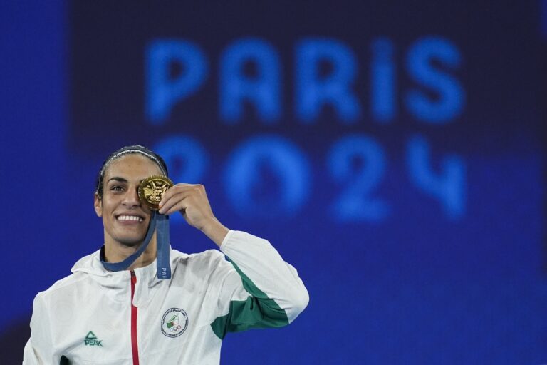 Gold medalist Algeria's Imane Khelif poses during a medals ceremony for the women's 66 kg final boxing match at the 2024 Summer Olympics, Friday, Aug. 9, 2024, in Paris, France. (AP Photo/John Locher)