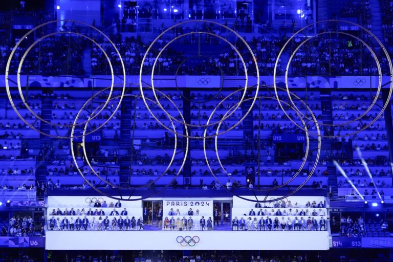 The audience watches during the 2024 Summer Olympics closing ceremony at the Stade de France, Sunday, Aug. 11, 2024, in Saint-Denis, France. (AP Photo/Rebecca Blackwell)