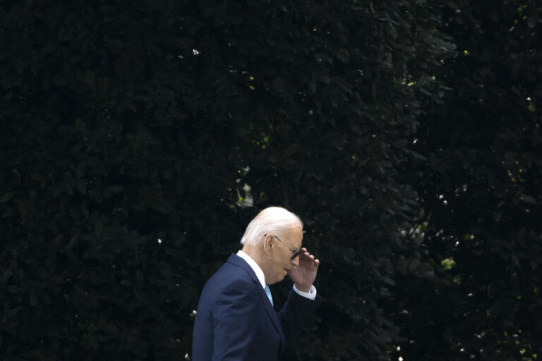 President Joe Biden walks across the South Lawn of the White House, Thursday, Aug. 15, 2024, in Washington, after returning from a trip to Prince George's County, Md. (AP Photo/Mark Schiefelbein)