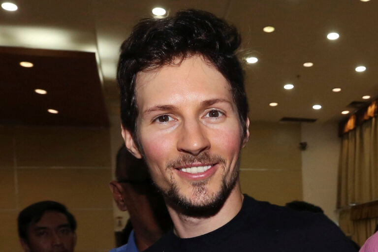 Telegram co-founder Pavel Durov, center, smiles following his meeting with Indonesian Communication and Information Minister Rudiantara in Jakarta, Indonesia on Aug. 1, 2017. (AP Photo/Tatan Syuflana)