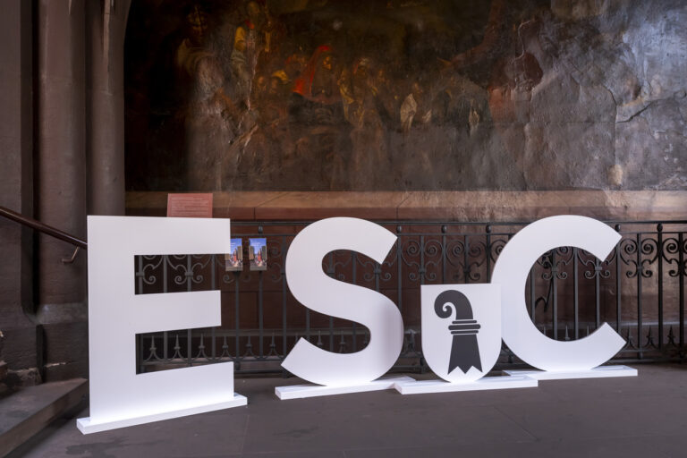 The letters ESC (Eurovision Song Contest) and a Basel emblem can be seen in the courtyard of Basel's town hall in Basel, on Friday, August 30, 2024. The ESC 2025 will be held in Basel. This was announced today by the SRG. (KEYSTONE/Georgios Kefalas)