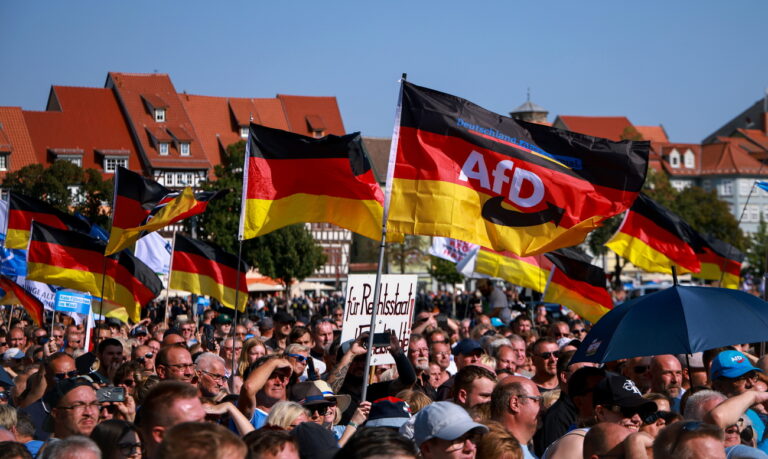 epa11575677 Supporters of far-right Alternative for Germany (AfD) party await the speech of faction chairman in the regional parliament of Thuringia Bjoern Hoecke, top candidate for the upcoming 2024 Thuringia state election during the final election campaign rally in Erfurt, Germany, 31 August 2024. Thuringia state election, voting for the regional parliament 'Landtag', will be held on 01 September 2024. EPA/CLEMENS BILAN