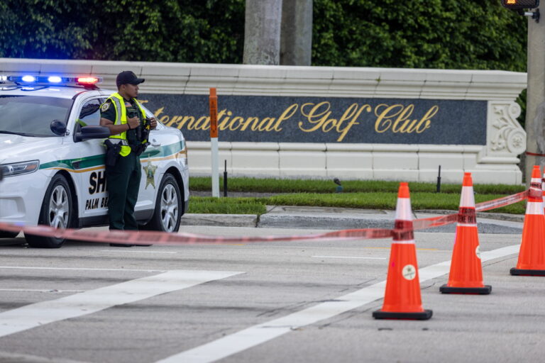 epa11606878 Palm Beach Sheriff officers guard the rear entrance of the Trump International Golf Club in West Palm Beach, Florida, USA on 15 September 2024, where gunshots were reported. According to the FBI, they are following an investigation of what appears to be an attempted assassination of Former President Donald Trump. Palm Beach County Sheriff Ric Bradshaw said the US Secret Service agents found a man pointing an AK-style rifle with a scope into the club as Trump was on the course. EPA/CRISTOBAL HERRERA-ULASHKEVICH