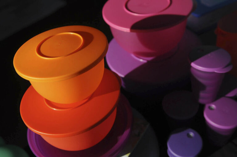 FILE - Colorful Tupperware products are seen in Bellflower, Calif. on Aug. 5, 2011. (AP Photo/Garrett Cheen, File)