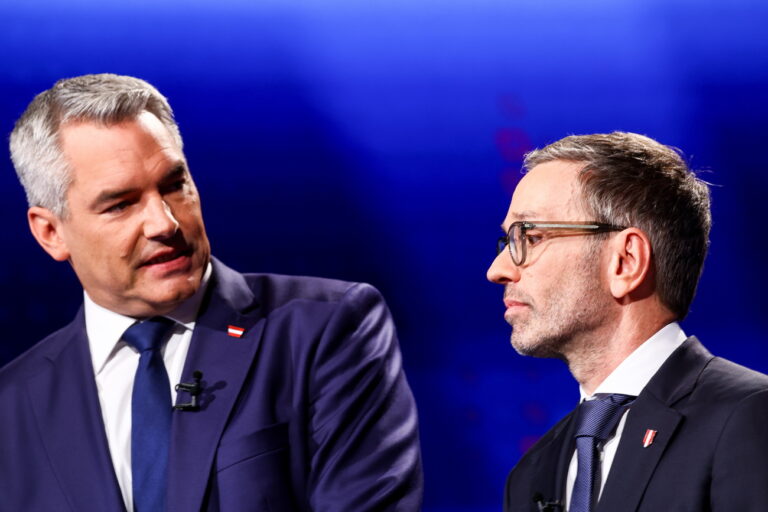 epa11626917 Austrian Chancellor and Head of the Austrian People's Party (OeVP) Karl Nehammer (L) and chairman and top candidate of the Freedom Party of Austria (FPOe) Herbert Kickl (R) look on prior to the pre-election tv debate in Vienna, Austria, 26 September 2024. Austrian general elections will take place on 29 September. EPA/FILIP SINGER