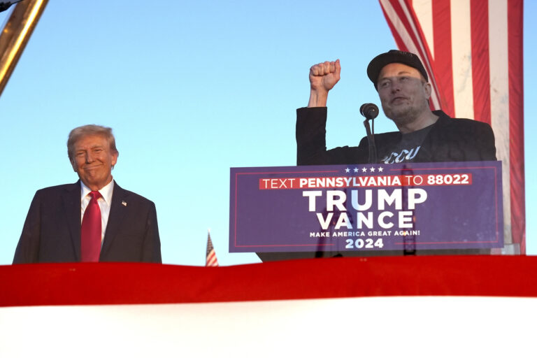 Tesla and SpaceX CEO Elon Musk speaks as Republican presidential nominee former President Donald Trump listens at a campaign event at the Butler Farm Show, Saturday, Oct. 5, 2024, in Butler, Pa. (AP Photo/Alex Brandon).Donald Trump