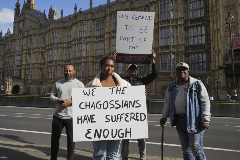 Chagossians Whitney Tranquille, center, attends a protest to response the U.K. announcement to agree to hand sovereignty of the long-contested Chagos Islands to Mauritius and against their 