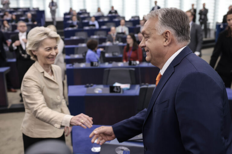 Ursula Von der Leyen, left, shakes hands with Hungarian Prime Minister and President of EU Council Viktor Orban in the hemicycle of the European parliament in Strasbourg, France, during a debate on the hungarian programme council presidency, Wednesday Oct. 9, 2024. (AP Photo/Jean-Francois Badias)