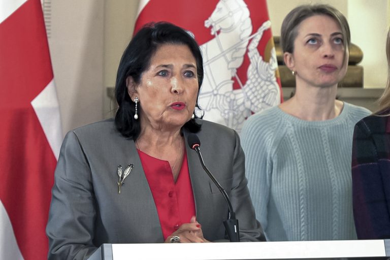 In this photo taken from video, Georgian President Salome Zourabichvili, left, speaks to the media as speaks to the media as and Nana Malashkhia, who leads the Coalition for Change parliament list, right, stands near, after the parliamentary election in Tbilisi, Georgia, on Sunday, Oct. 27, 2024. (AP Photo/Kostya Manenkov).Salome Zourabichvili