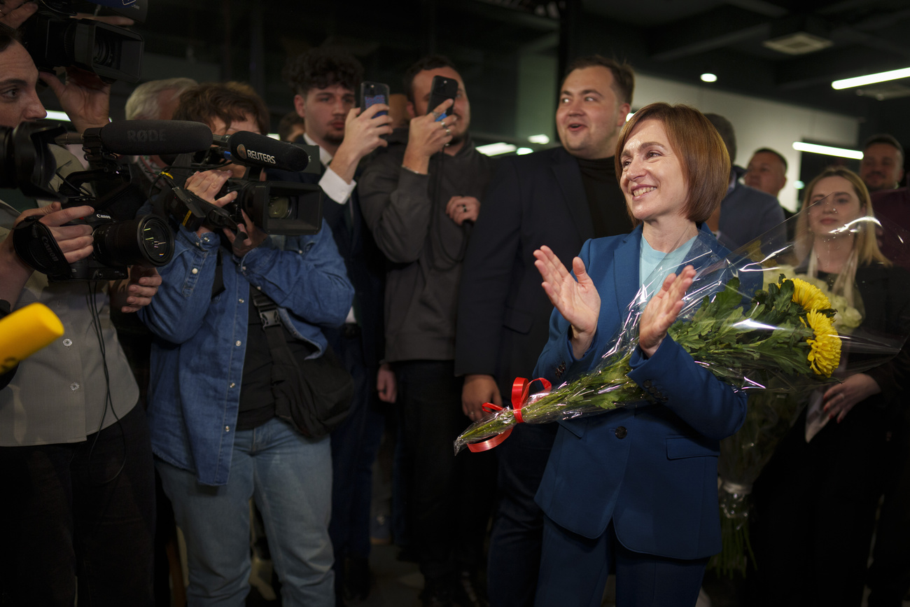 Moldova's President Maia Sandu celebrates with supporters as preliminary results are announced for the presidential election runoff in Chisinau, Moldova, late Sunday, Nov. 3, 2024. (AP Photo/Vadim Ghirda).Maia Sandu