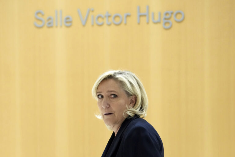 French far-right leader Marine Le Pen arrives at the courtroom for the trial over the suspected embezzlement of European Parliament funds, Wednesday, Nov. 6, 2024 in Paris. (AP Photo/Aurelien Morissard)