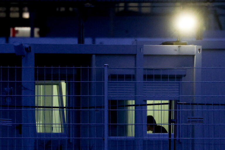 epa11766883 A refugee is seen inside of one of containers used as houses for refugees at former Berlin Tempelhof airport in Berlin, Germany, 09 December 2024. Germany's Federal Office for Migration and Refugees (BAMF) on 09 December froze asylum procedures for Syrian nationals due to the unclear political situation in Syria, following the fall of Syrian leader Bashar al-Assad on 08 December, according to the post of German Interior Minister Nancy Faeser on platform X. EPA/FILIP SINGER