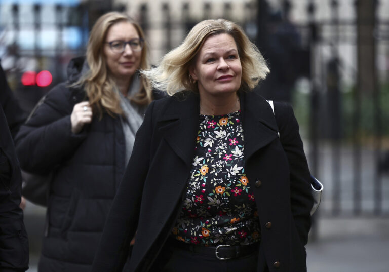 Germany's Interior Minister Nancy Faeser, right, arrives for a meeting of European leaders and agencies at Carlton Gardens in London, Tuesday, Dec. 10, 2024. (Henry Nicholls/Pool Photo via AP)